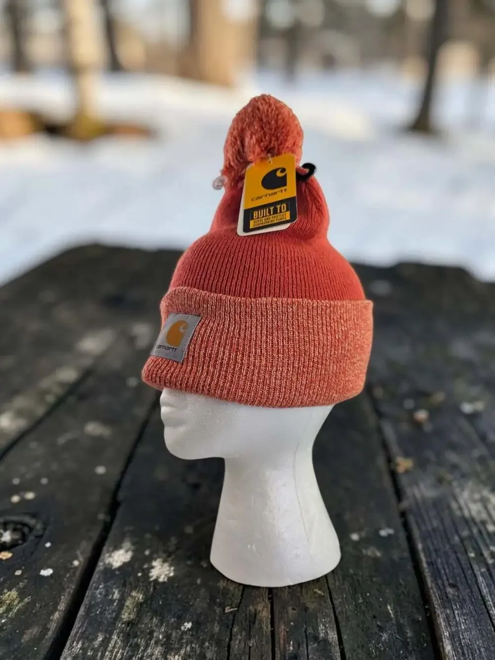 Carhartt Women's Lookout Pom Cuffed Knit Beanie Hat in Rust Orange